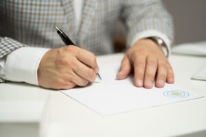 Tenant signing lease agreement with landlord - essential for understanding legal responsibilities.