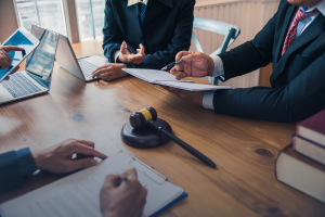 Lawyer and client reviewing legal documents at a desk - Headley Legal Support Florida