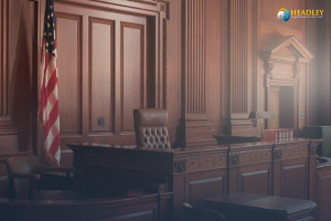 Empty courtroom with a judge's bench and American flag. - Headley Legal Support Services Florida