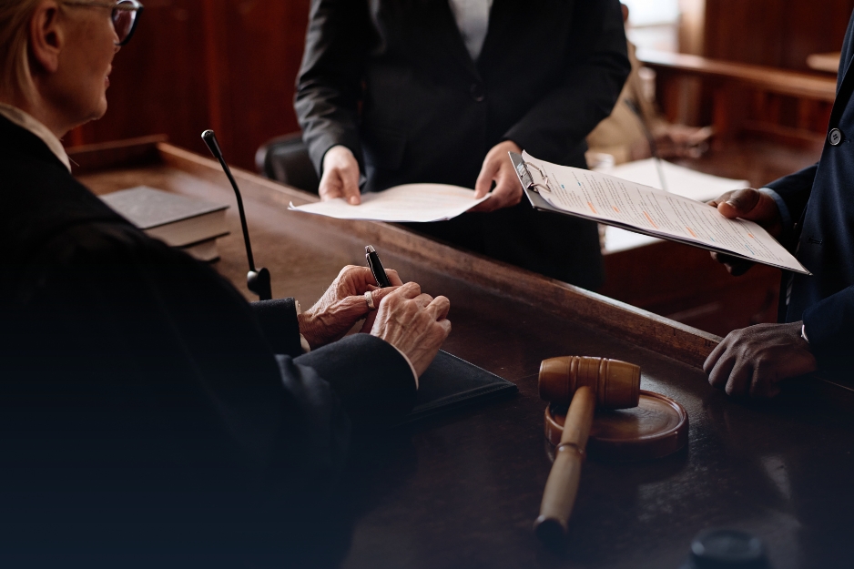 A judge and attorney reviewing a live transcript displayed on a screen in a courtroom - Headley Legal Support Services Florida